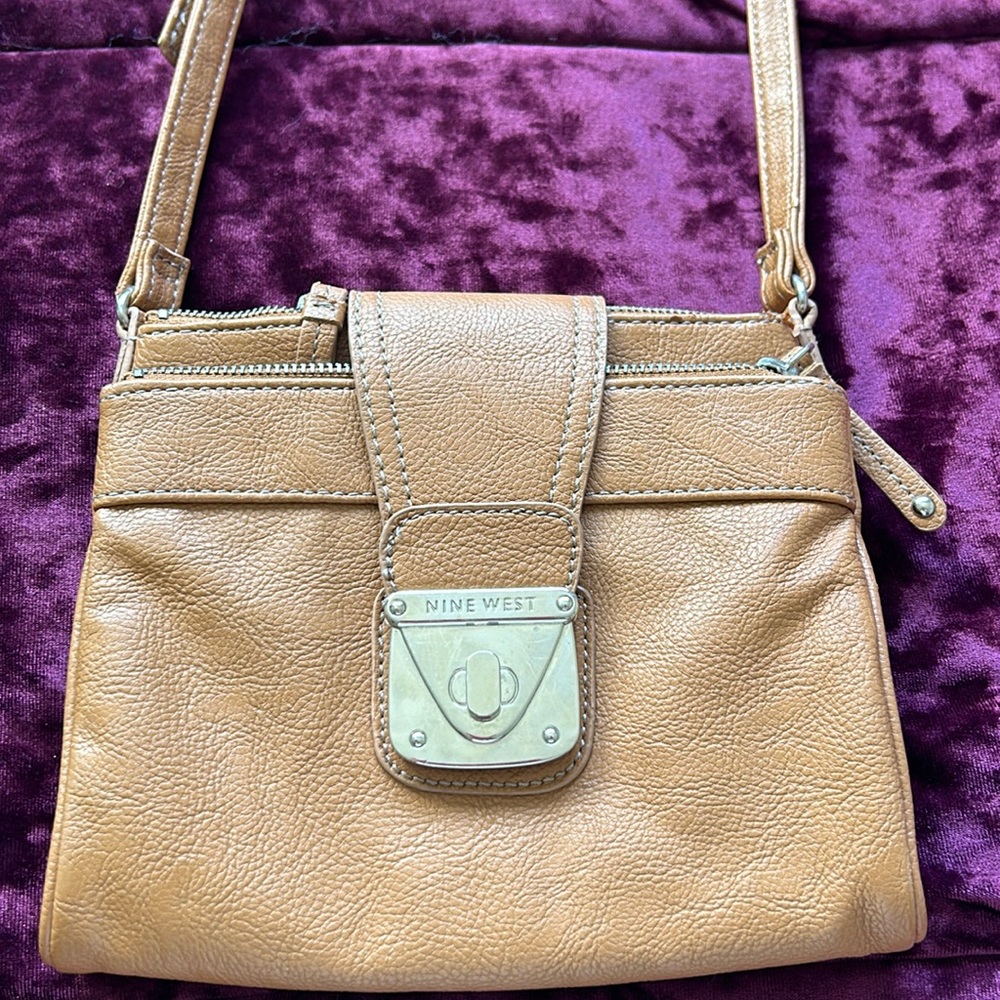 Nine West satchel, light brown,2 pocket zip up sides,small but a lot of storage